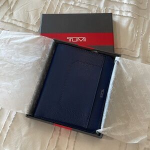 TUMI Blue Passport Case 
Brand New in Box